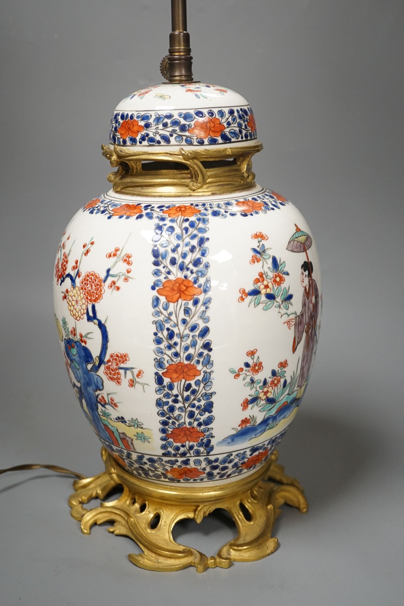 A European porcelain table lamp in the Oriental style, 63 cms high.